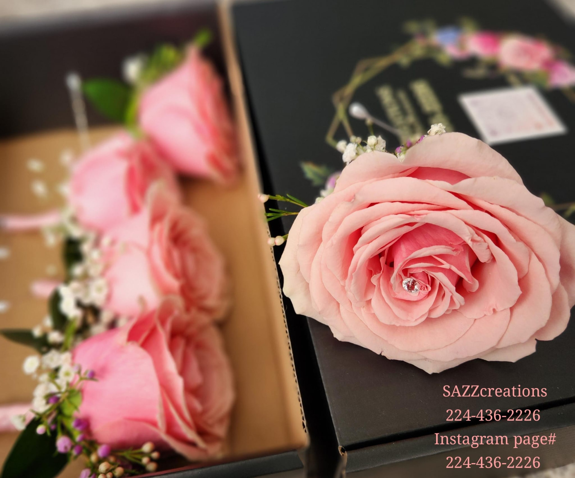 Pink rose boutonnieres with baby's breath and pearl pins arranged in a gift box