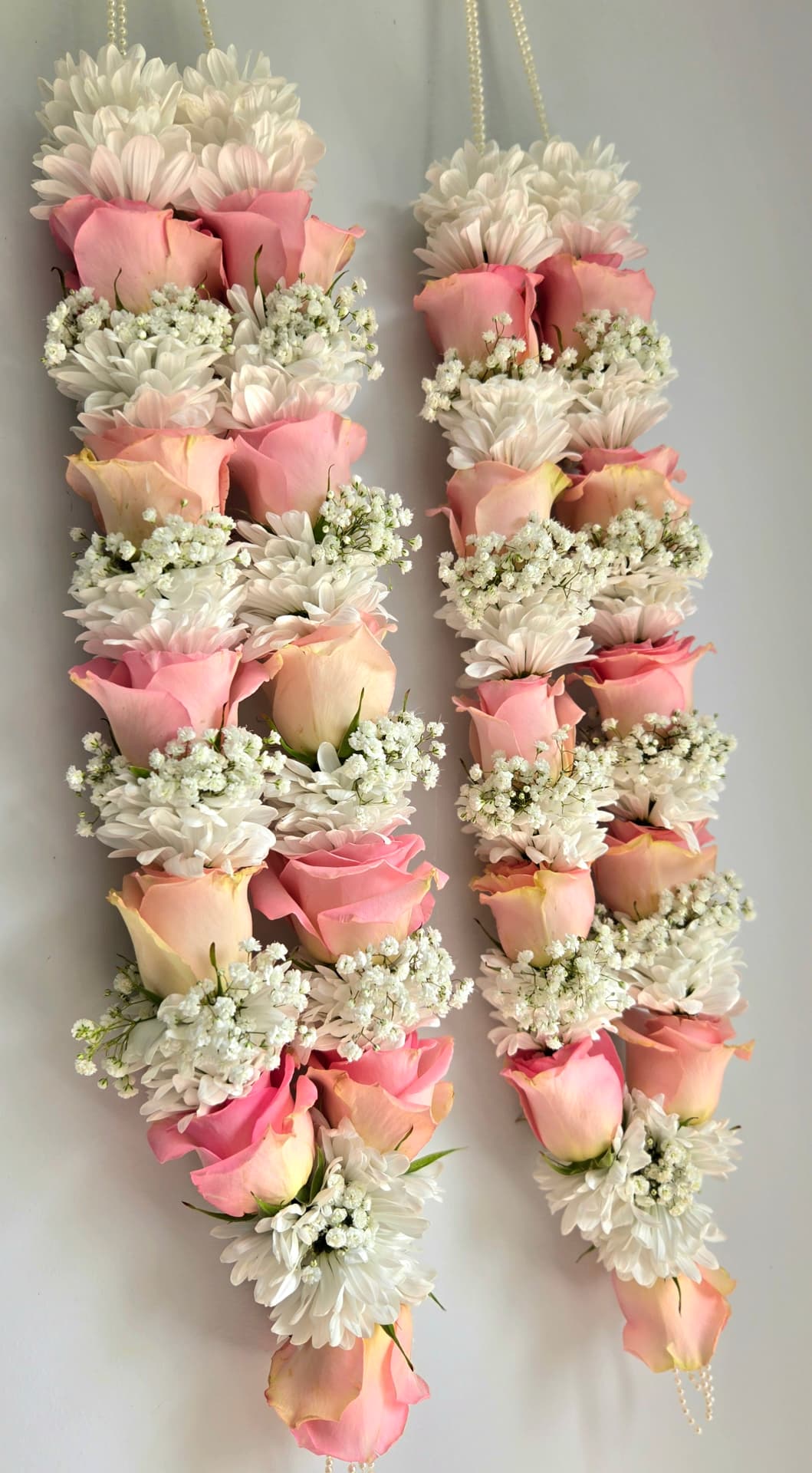 Blush pink rose and white chrysanthemum garland pair with baby's breath and pearl strands