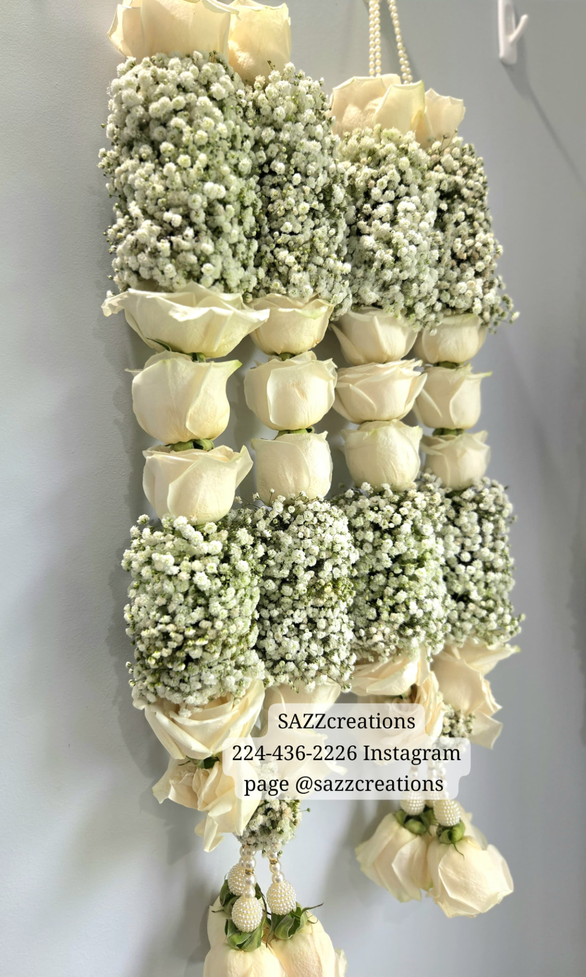 Hanging white rose and baby's breath garland with pearl tassels