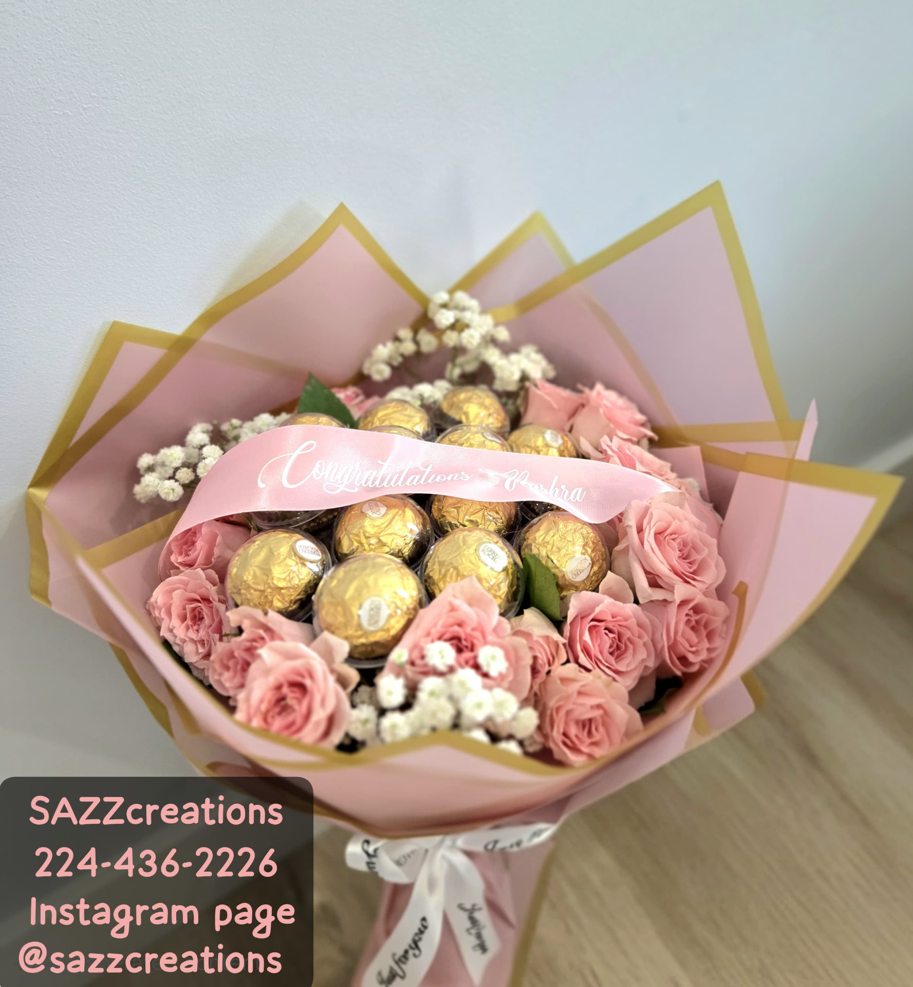 Pink rose and Ferrero Rocher bouquet with a personalized Congratulations ribbon, baby's breath and gold-edged pink wrapping