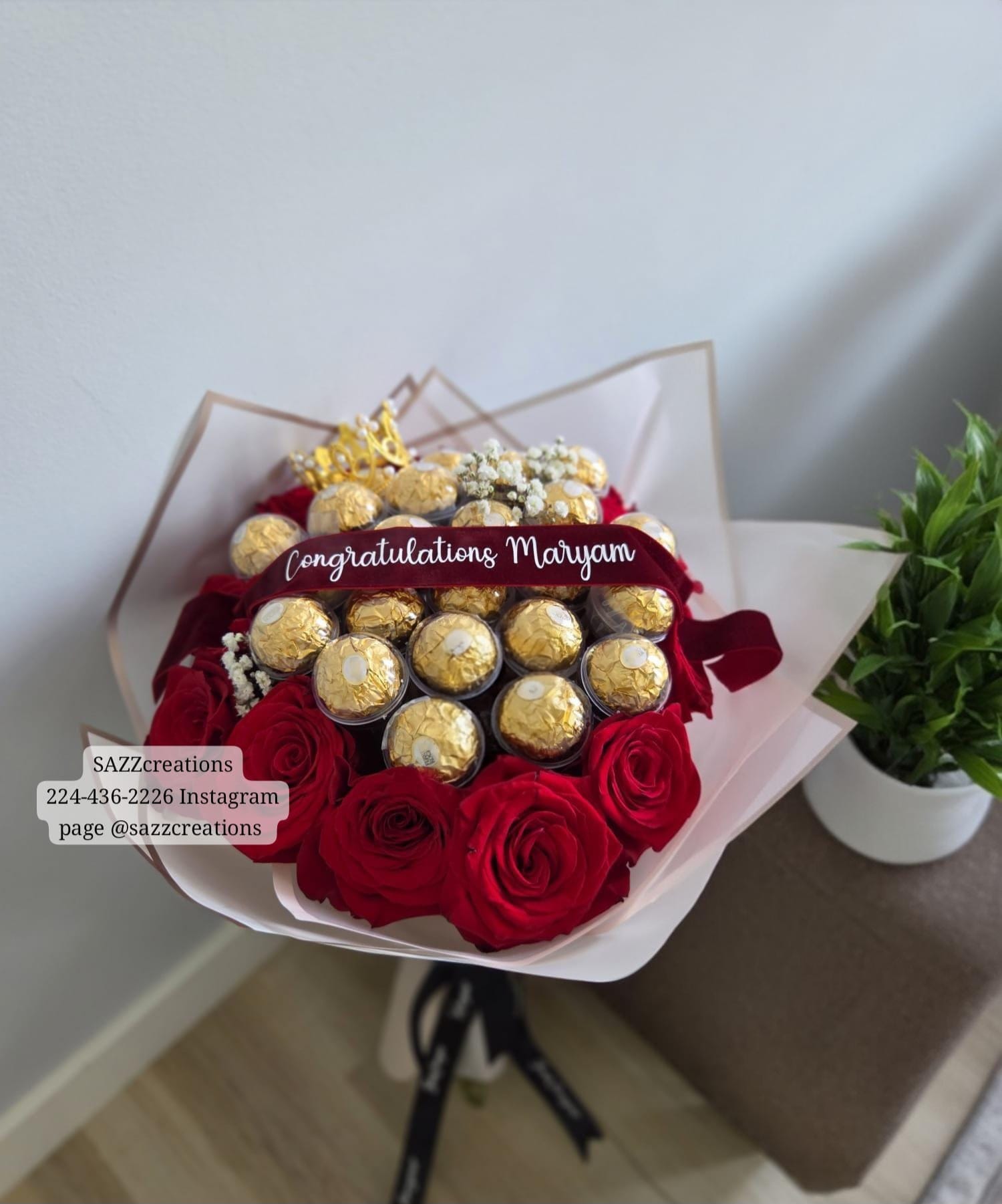 Red rose and Ferrero Rocher bouquet with a personalized Congratulations ribbon, gold crown and baby's breath