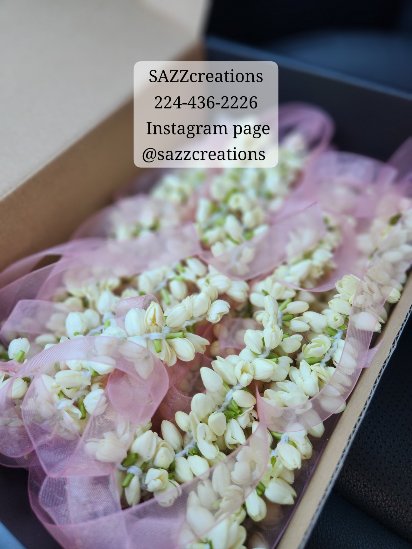 Fresh jasmine hand gajrey strings with pink organza ribbon in a gift box