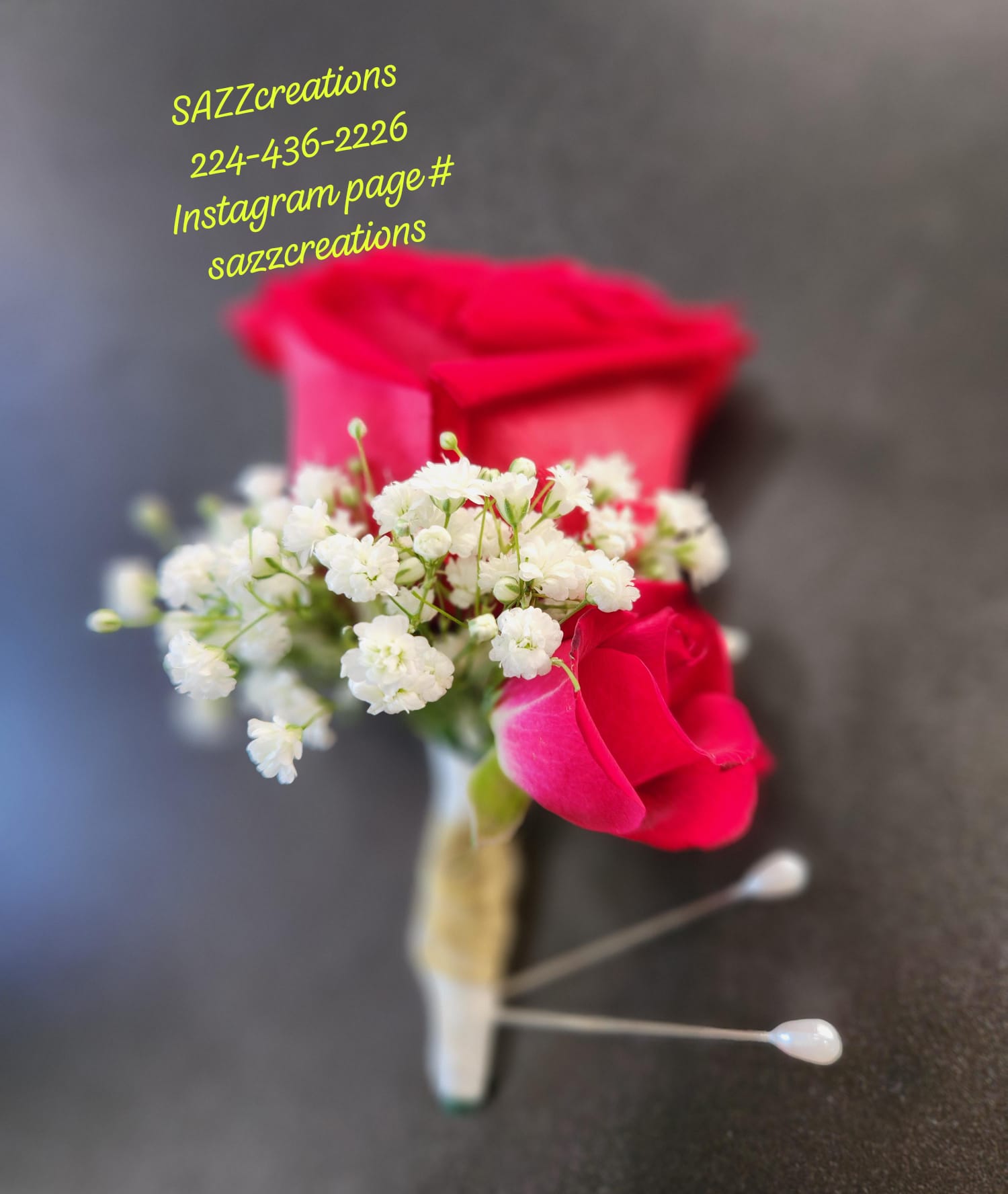 Red spray rose boutonniere with baby's breath and white ribbon wrap