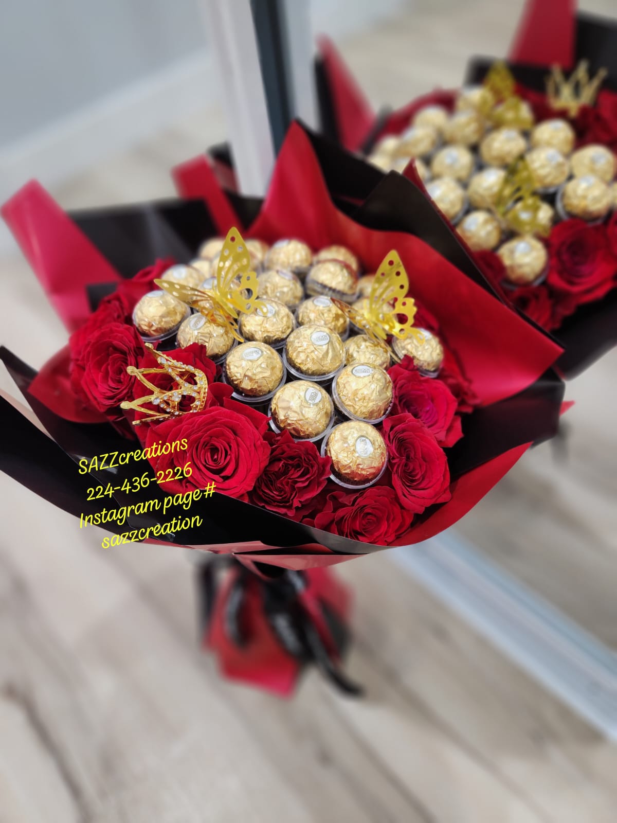 Ferrero Rocher and red rose bouquet wrapped in black and red paper with gold butterflies and crown