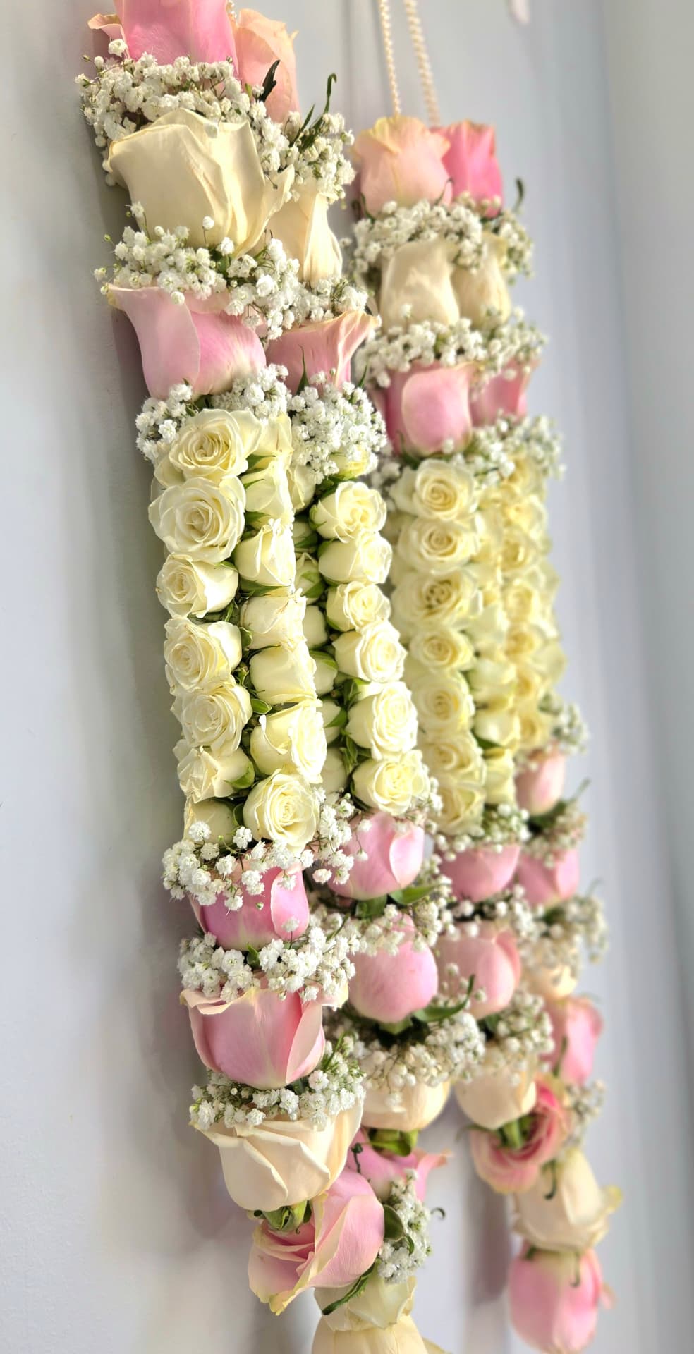 Pink and ivory rose wedding garland pair with baby's breath