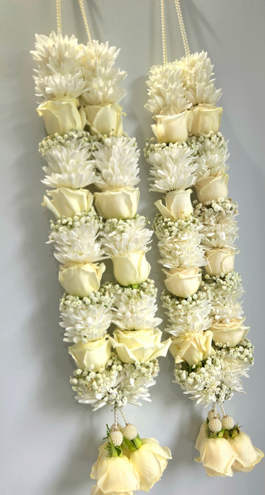 Ivory rose and white chrysanthemum garland pair with baby's breath and pearl tassels